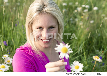 Photo of pretty blonde woman on a field Photo of pretty blonde woman on a field 16600679