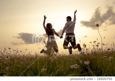 Young couple in love outdoor at the sunset 16600700
