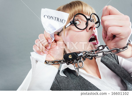Furious woman with chained hands and contract 16601102