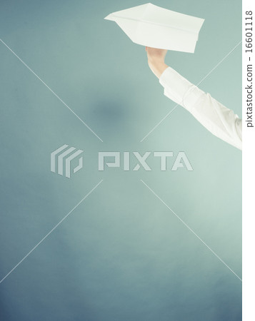 Woman holding airplane in hand. 16601118