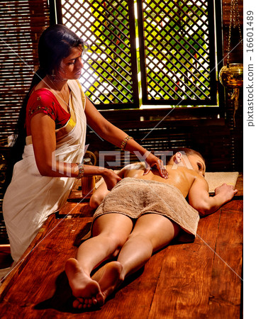 Woman having Ayurvedic spa treatment. 16601489
