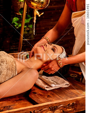 Woman having ayurveda spa treatment. Woman having ayurveda spa treatment. 16601491