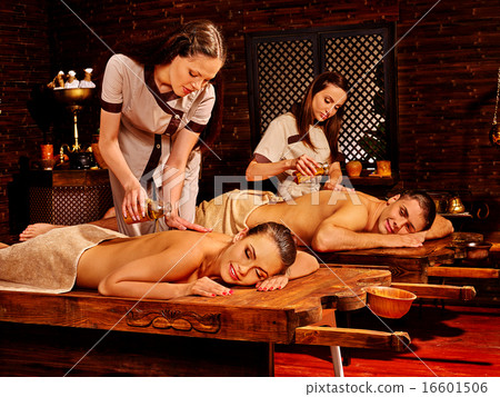 Couple having Ayurvedic spa treatment. 16601506