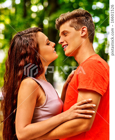 Couple  with flower at park. 16601526