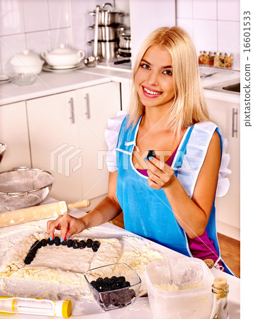 Girl baking cookies in the oven Girl baking cookies in the oven 16601533