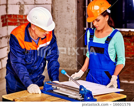 Group people builder cutting ceramic tile. 16601576