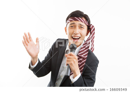 A businessman singing karaoke in a good mood 16609349