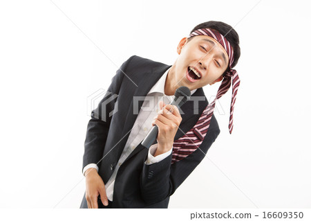 A businessman singing karaoke in a good mood A businessman singing karaoke in a good mood 16609350