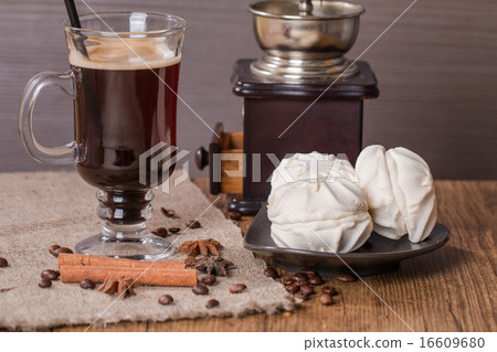 Coffee in glass cup and cinnamon with zephyr Coffee in glass cup and cinnamon with zephyr 16609680