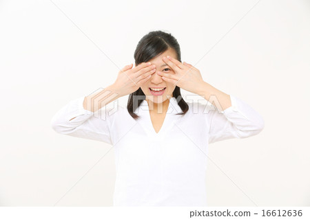 A woman looking into A woman looking into 16612636