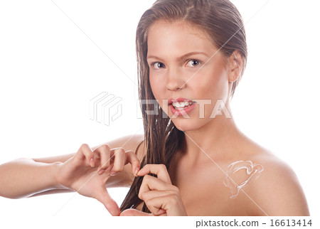 Teen girl with nude makeup shows heart. 16613414