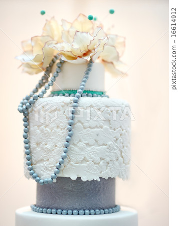 Delicious white and grey wedding cake 16614912
