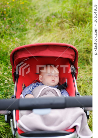 Baby sleeping in stroller 16614919