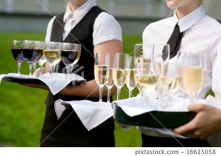 Waitress with dish of champagne glasses 16615058