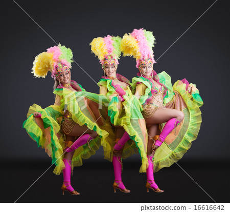 Fascinating dancers in colorful carnival costumes Fascinating dancers in colorful carnival costumes 16616642