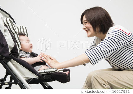 Baby and mother riding a stroller Baby and mother riding a stroller 16617921