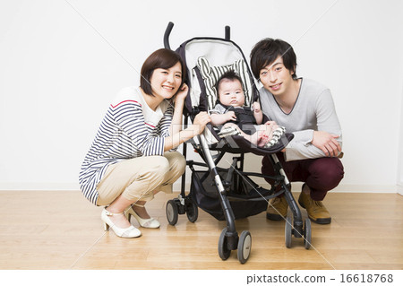 Baby riding a stroller, dad and mama 16618768