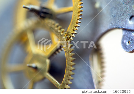 background with metal cogwheels a clockwork. macro 16620935