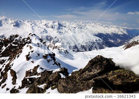 Winter snow covered mountain peaks in Austrian alps 16621343