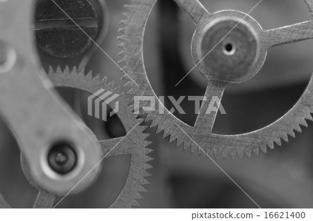 Black white metal cogwheels a clockwork. Macro 16621400