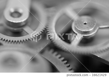 Black white metal cogwheels a clockwork. Macro Black white metal cogwheels a clockwork. Macro 16621429