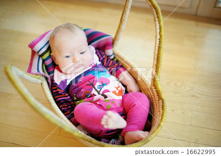 Baby girl lying in a basket Baby girl lying in a basket 16622995