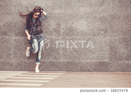girl is walking in the downtown girl is walking in the downtown 16625478
