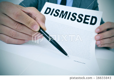 businessman shows document with text dismissed businessman shows document with text dismissed 16633843