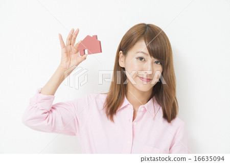 Business woman with house model Business woman with house model 16635094