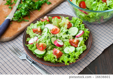 Tomato and cucumber salad with lettuce leafes Tomato and cucumber salad with lettuce leafes 16636601