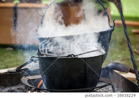 Soup cooking in medieval pot Soup cooking in medieval pot 16638224