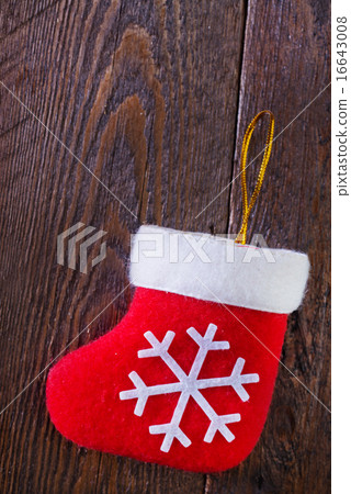 red sock on wooden board red sock on wooden board 16643008