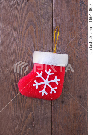 red sock on wooden board red sock on wooden board 16643009