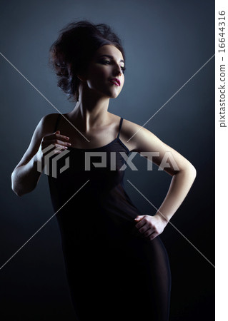 Sexy brunette in negligee looks like doll 16644316