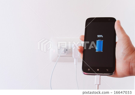 female hand plugging in the plug of her smartphone female hand plugging in the plug of her smartphone 16647033