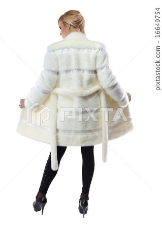 Blonde in white unbuttoned coat, from back Blonde in white unbuttoned coat, from back 16649754