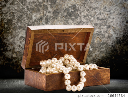 Wooden chest with white pearl necklace Wooden chest with white pearl necklace 16654584