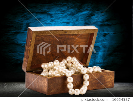 Wooden chest with white pearl necklace Wooden chest with white pearl necklace 16654587