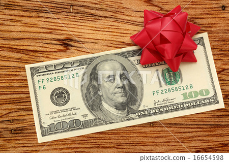 Dollars with decorative bow Dollars with decorative bow 16654598