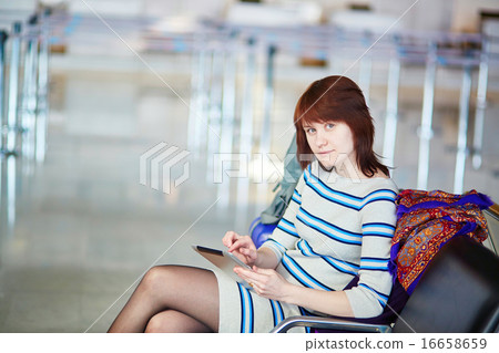 Beautiful young female passenger at the airport Beautiful young female passenger at the airport 16658659