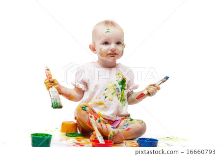 Baby soiled by paints holds brushes in hand Baby soiled by paints holds brushes in hand 16660793