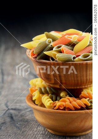 Raw eliche and penne tricolori pasta  16662078