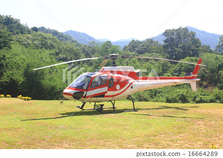 helicopter standing on landing strip 16664289