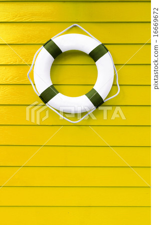 Scratched and dirty wood painted yellow Wood plank 16669672