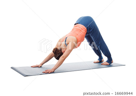 Beautiful sporty fit yogi girl practices yoga asana adhomukha sv 16669944