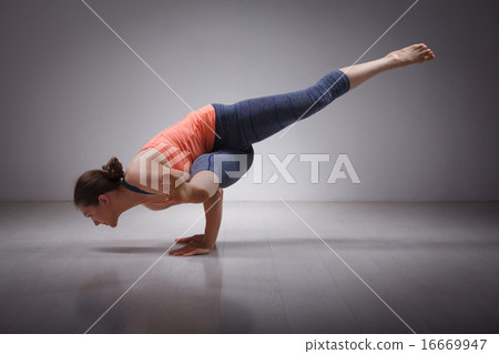 Beautiful sporty fit yogi girl practices yoga asana eka pada kou Beautiful sporty fit yogi girl practices yoga asana eka pada kou 16669947