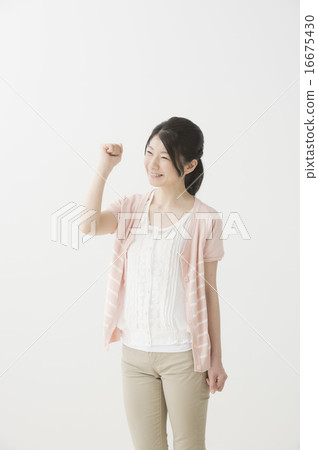 A woman doing a guts pose A woman doing a guts pose 16675430