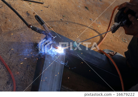 hand of worker welding metal 16679222