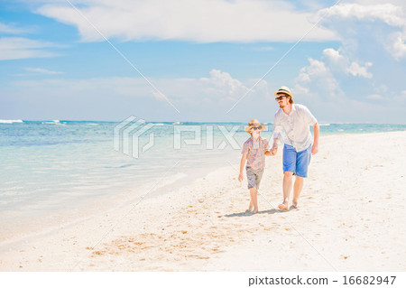 Happy father and his small son having great quality family time enjoying white sand ocean beach on 16682947