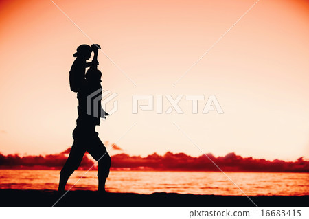 Silhouettes of father and son having fun together in sunset on summer holidays Silhouettes of father and son having fun together in sunset on summer holidays 16683415